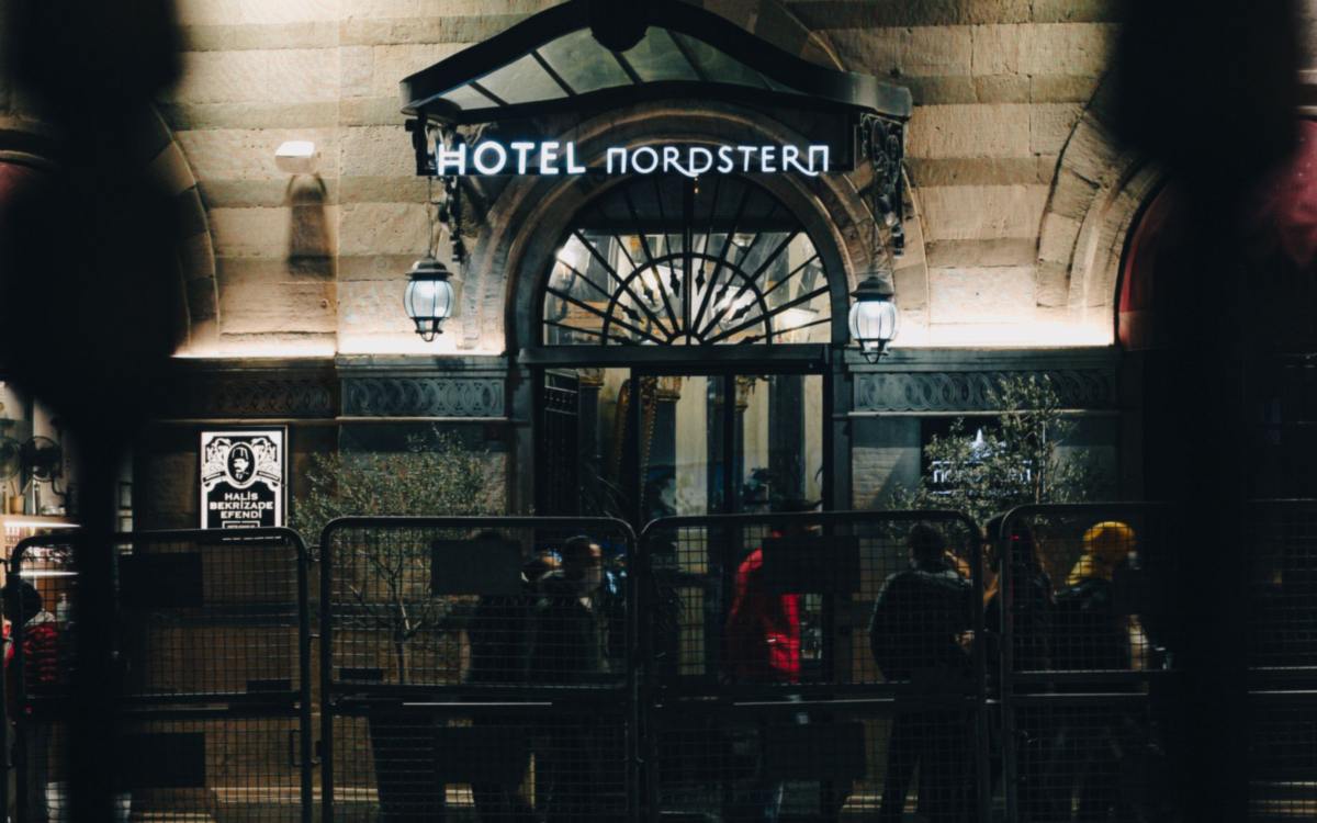 Hotel facade with warm LED outdoor lighting at night