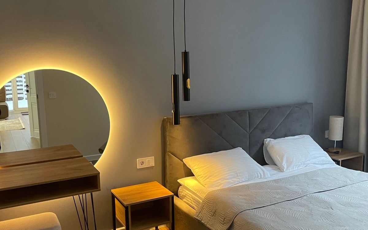 Hotel room with dimmable lighting and ambient light