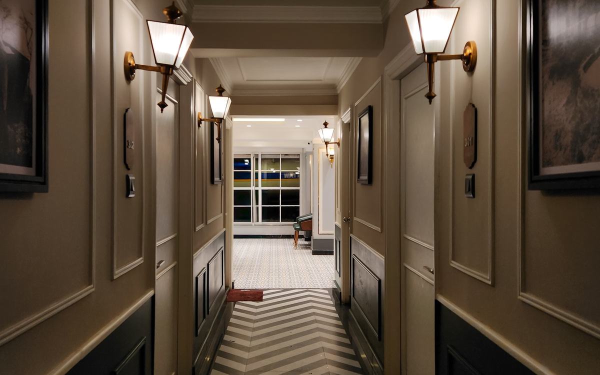 Hotel corridor with warm wall lights
