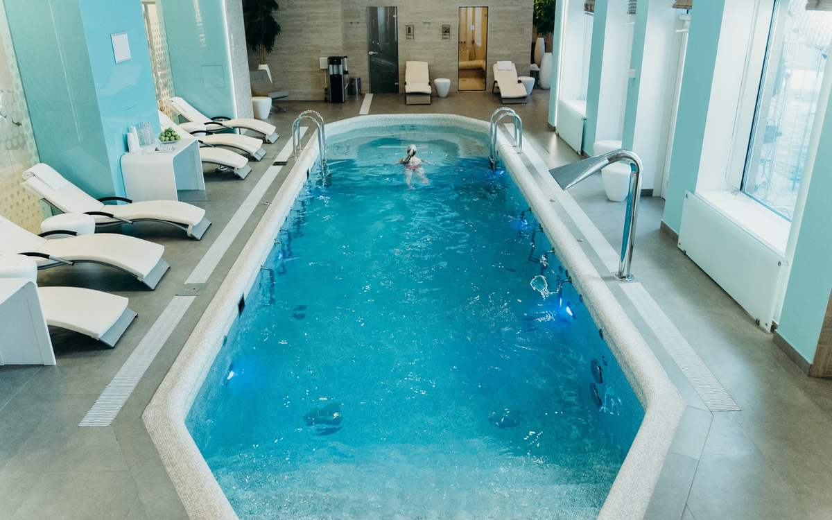 Hotel spa area with indoor pool and ambient light
